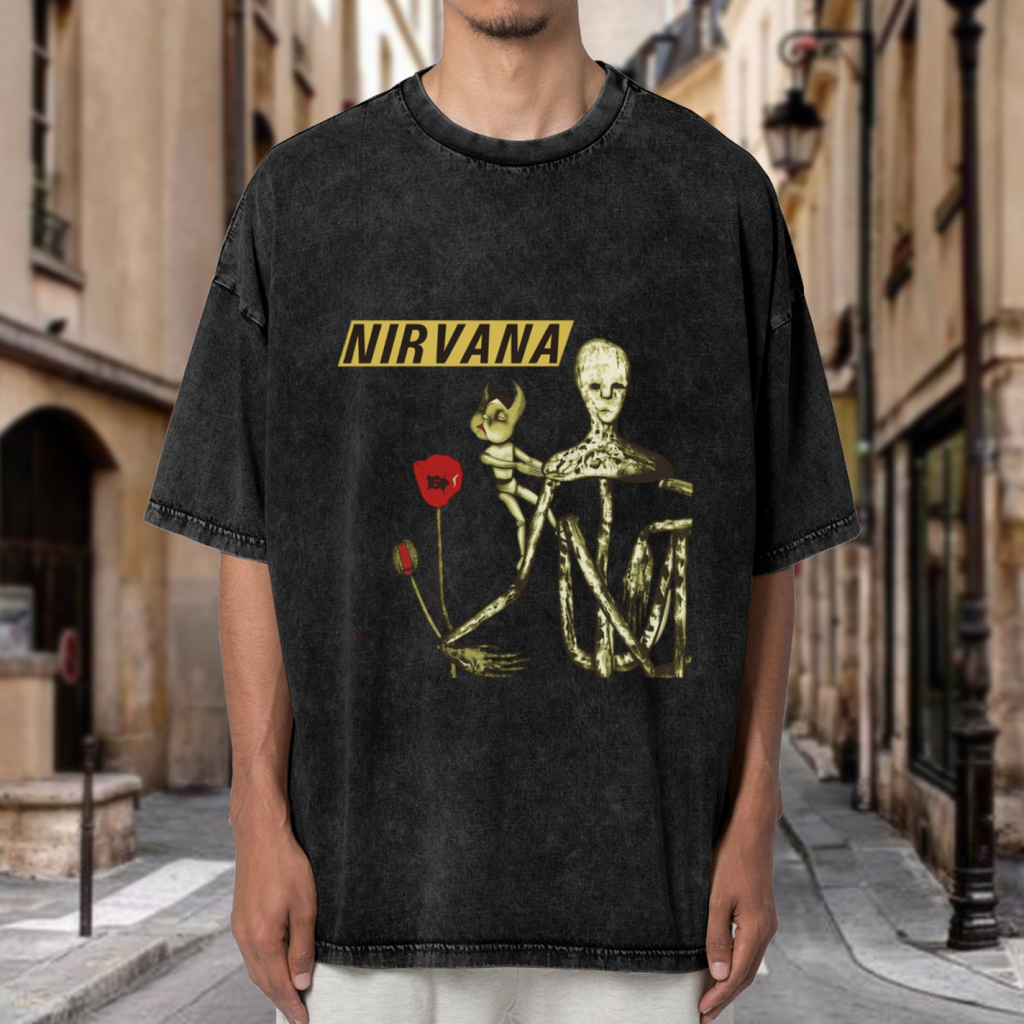 Nirvana Incesticide Album Washed Graphic Tee in Black, product image showing incesticide-inspired album imagery combining a doll figure and red poppy details.