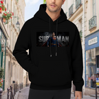 On-location model photograph displaying a classic caped portrait in a horizontal banner with prominent lettering on the front of a men's hoodie