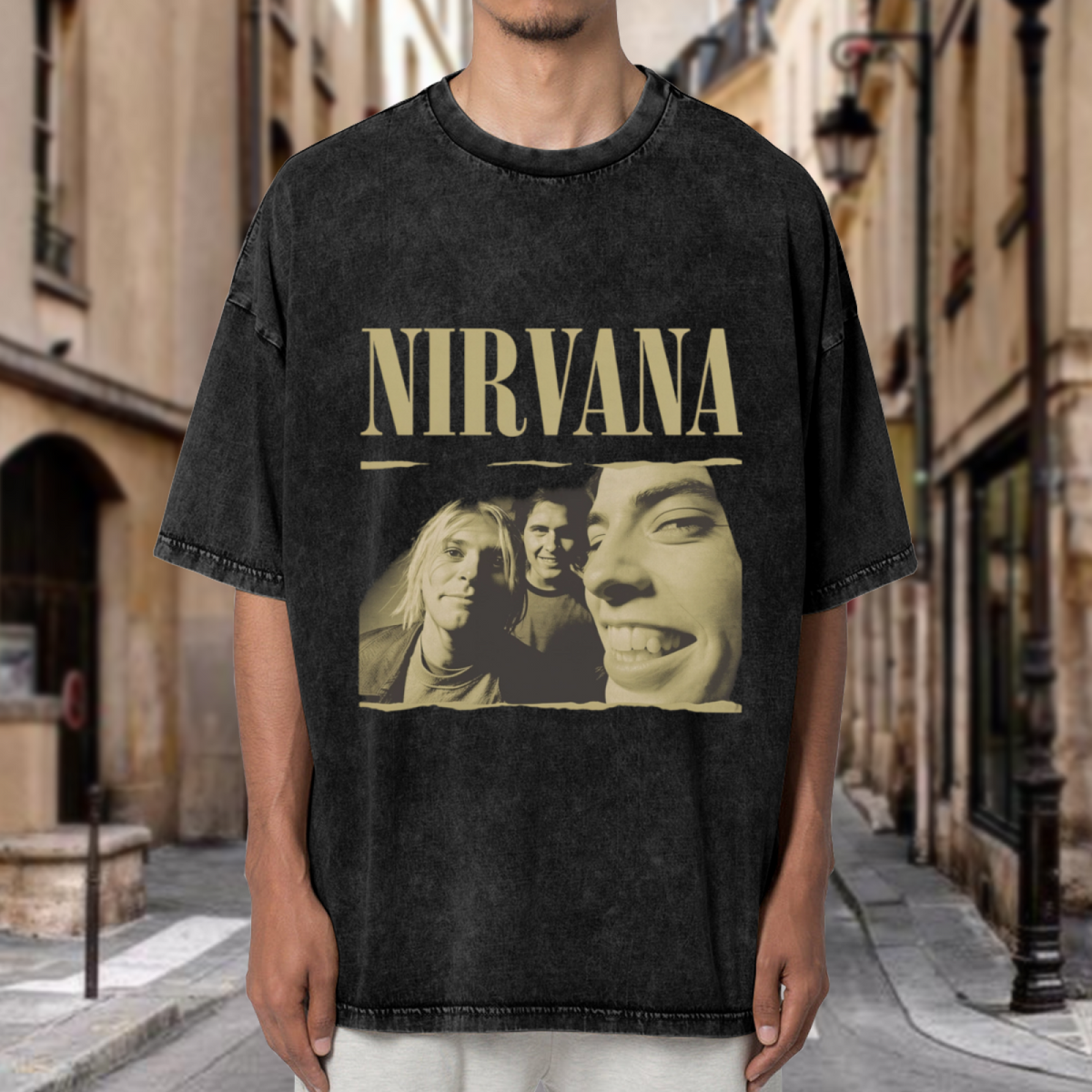 Nirvana Vintage Band Portrait Washed Tee in Black, product image showing a sepia-style band portrait presented with rough, torn-photo-inspired edges and prominent Nirvana lettering