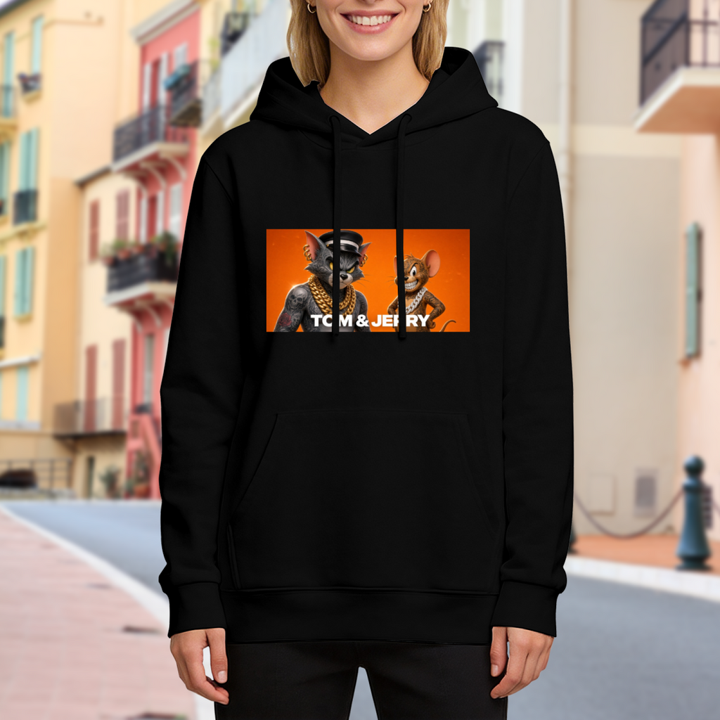 Lifestyle image outdoors: women's hoodie with a front graphic of a cartoon cat and mouse wearing gold chains in a portrait panel