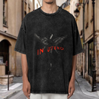 Nirvana In Utero Dark Angel Washed Tee in Black, product image showing an In Utero-inspired dark angel image with red typography.