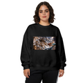 Women's crewneck sweatshirt seen on a model, its front graphic depicting a trident-bearing cat surrounded by surging waves in a sea battle