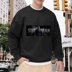 Outdoor photograph of a model in a men's crewneck sweatshirt bearing a classic caped portrait in a horizontal banner with prominent lettering