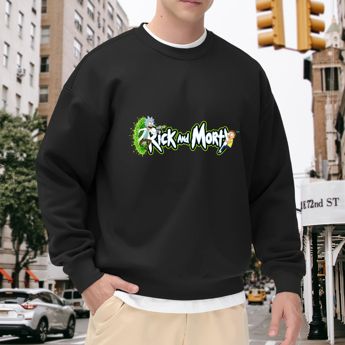 Men's crewneck sweatshirt worn outside, with the camera facing the graphic of two cartoon figures beside stylized lettering and a green portal