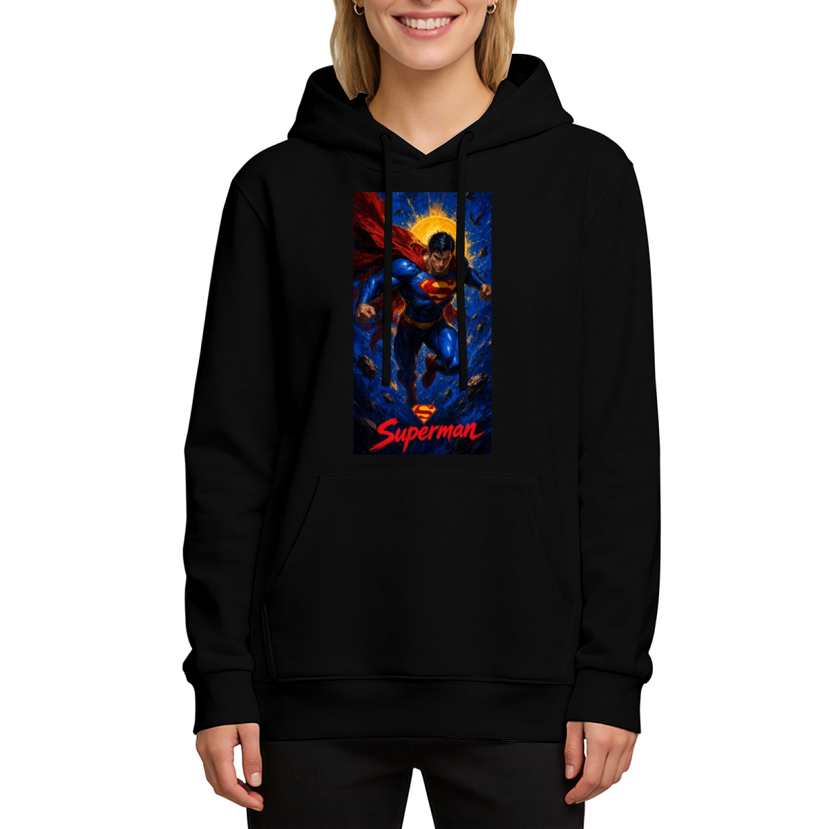 On-model product photo: women's hoodie bearing a caped figure ascending into a cosmic backdrop with a golden halo