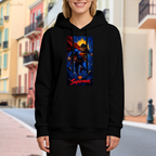 Lifestyle image outdoors: women's hoodie with a front graphic of a caped figure ascending into a cosmic backdrop with a golden halo